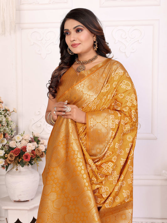 पीले रंग की समशीरा सॉफ्ट साटन सिल्क बंधेज प्रिंट साड़ी ऑलओवर ज़री बुनाई बॉर्डर के साथ