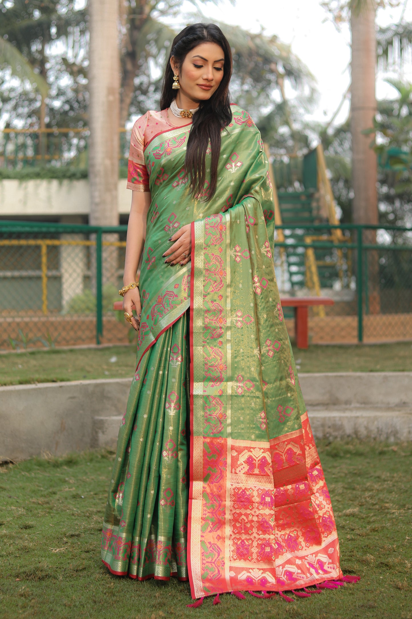 Green Isha Organza sarees with Ikkat Patola weave pallu with tassels