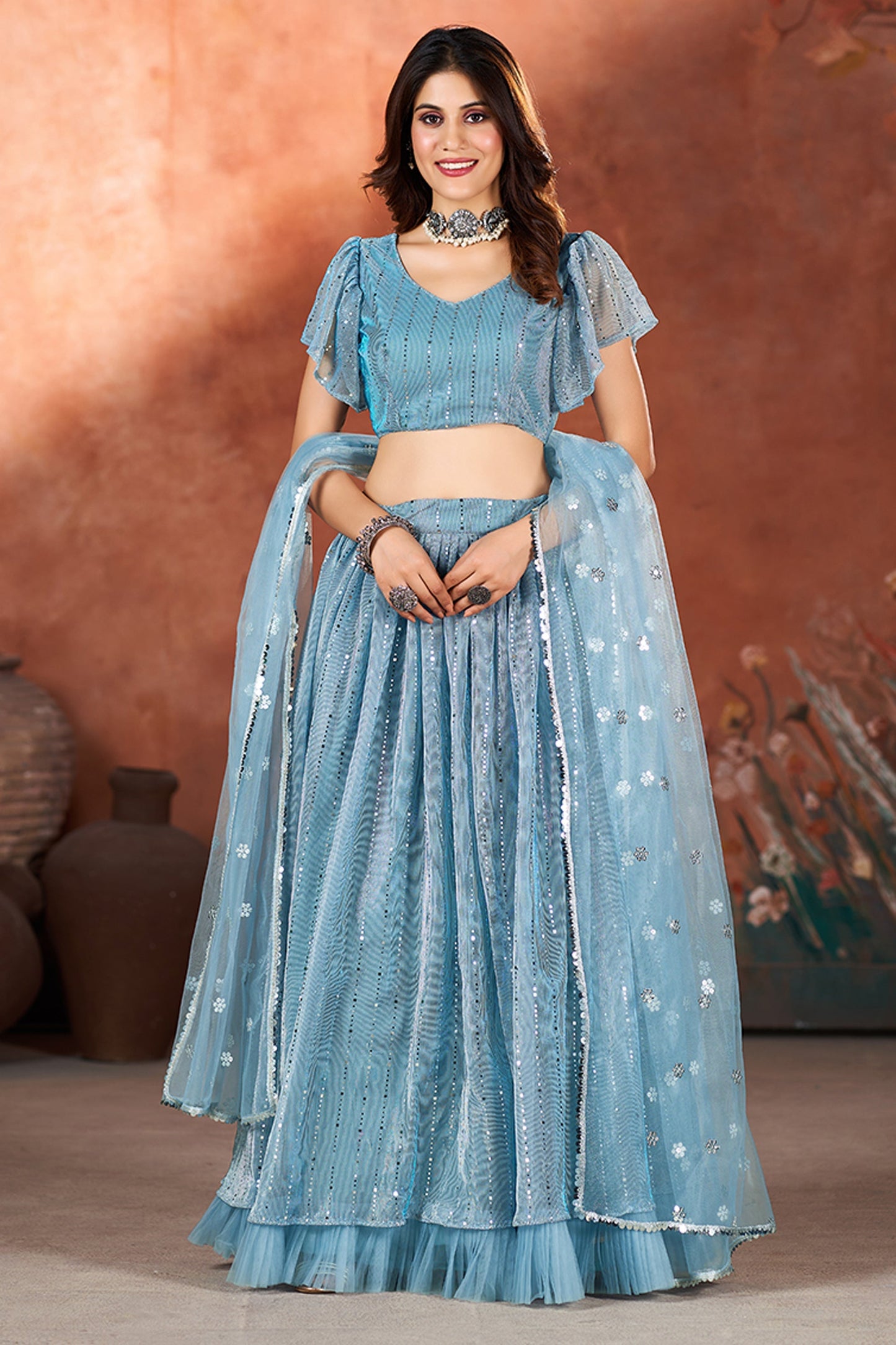 स्काई ब्लू कलर नेट फ़ैब्रिक फंक्शन वियर सेक्विन वर्क सुंदर लहंगा चोली