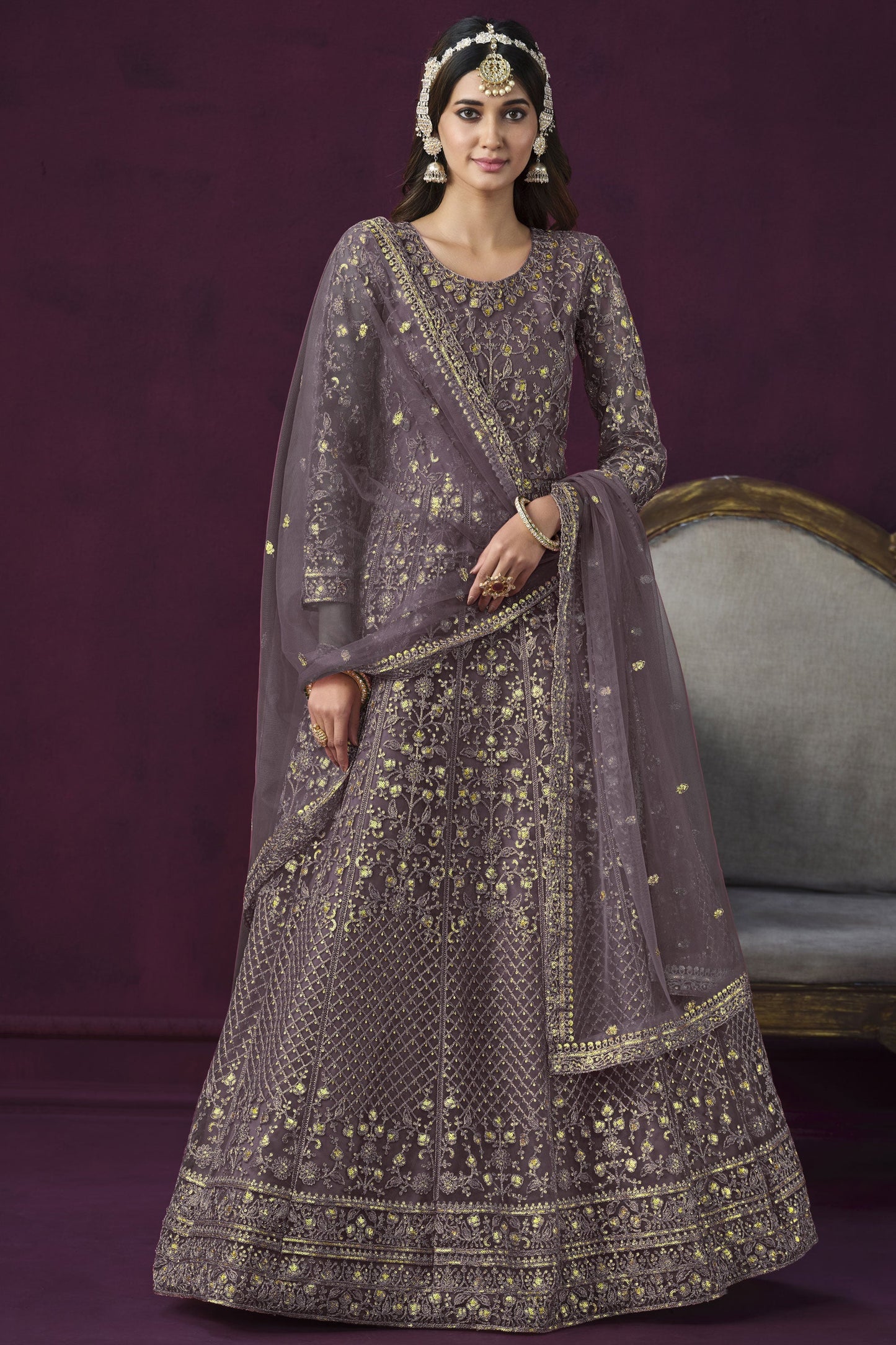 Attractive Embroidered Lavender Color Anarkali Salwar Kameez In Net Fabric