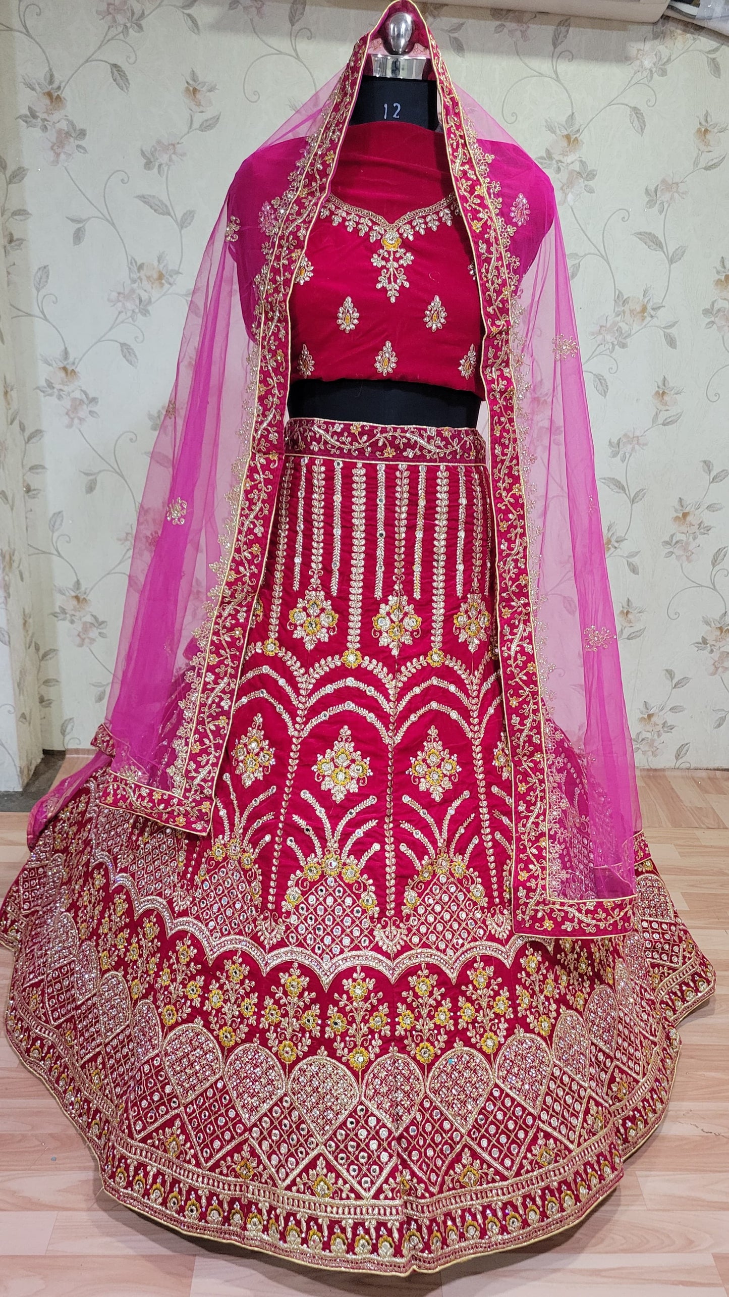 रानी पिंक कलर डिज़ाइनर ज़रकन डायमंड वर्क ब्राइडल लहंगा चोली