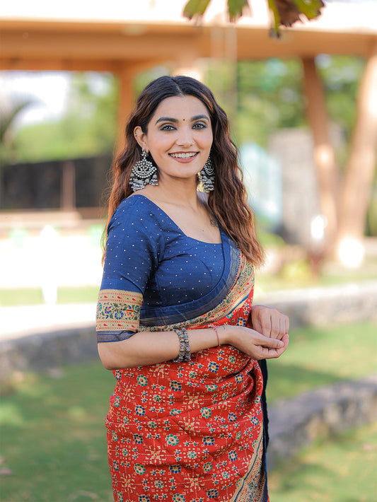 लाल रंग की फॉयल प्रिंटेड और स्टोन वर्क डोला सिल्क साड़ी