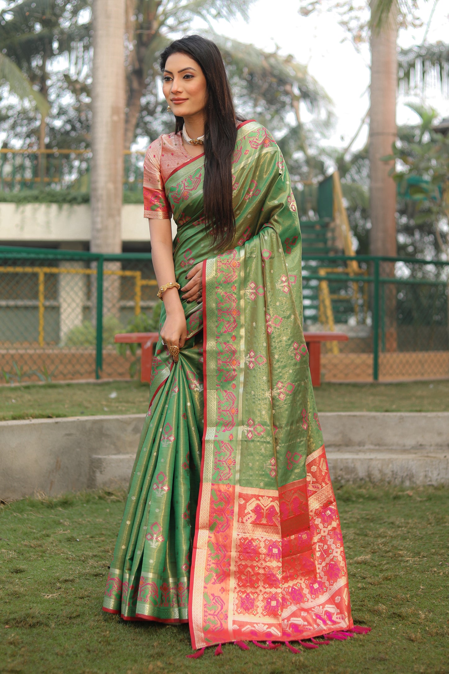 Green Isha Organza sarees with Ikkat Patola weave pallu with tassels