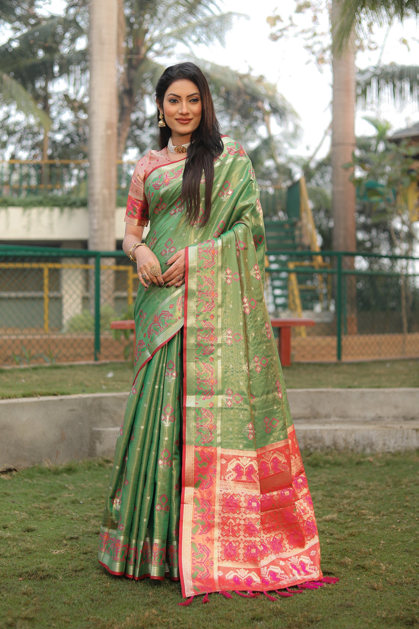 Green Isha Organza sarees with Ikkat Patola weave pallu with tassels