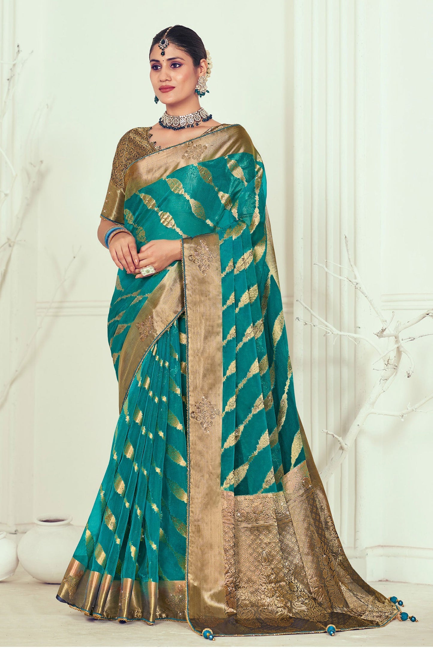 Organza Fabric Teal Color Coveted Weaving And Stone Work Saree