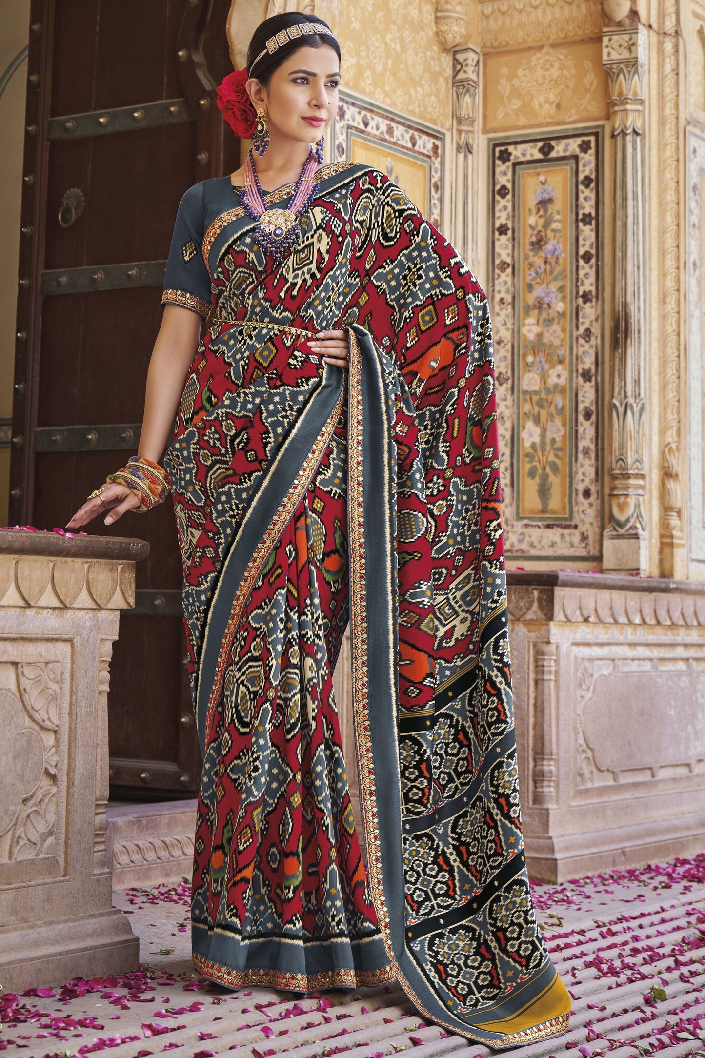 Imposing Printed Patola Silk Saree In Grey Color