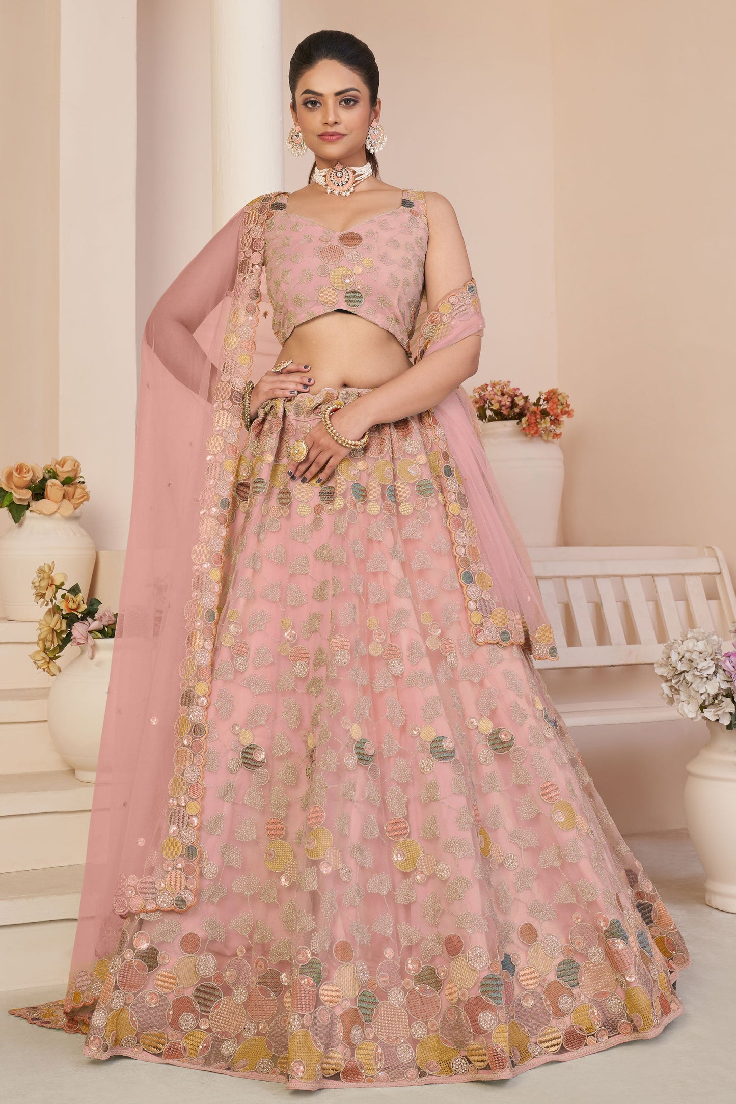 अद्भुत कढ़ाई डिजाइन पीच रंग नेट फैब्रिक लेहेंगा