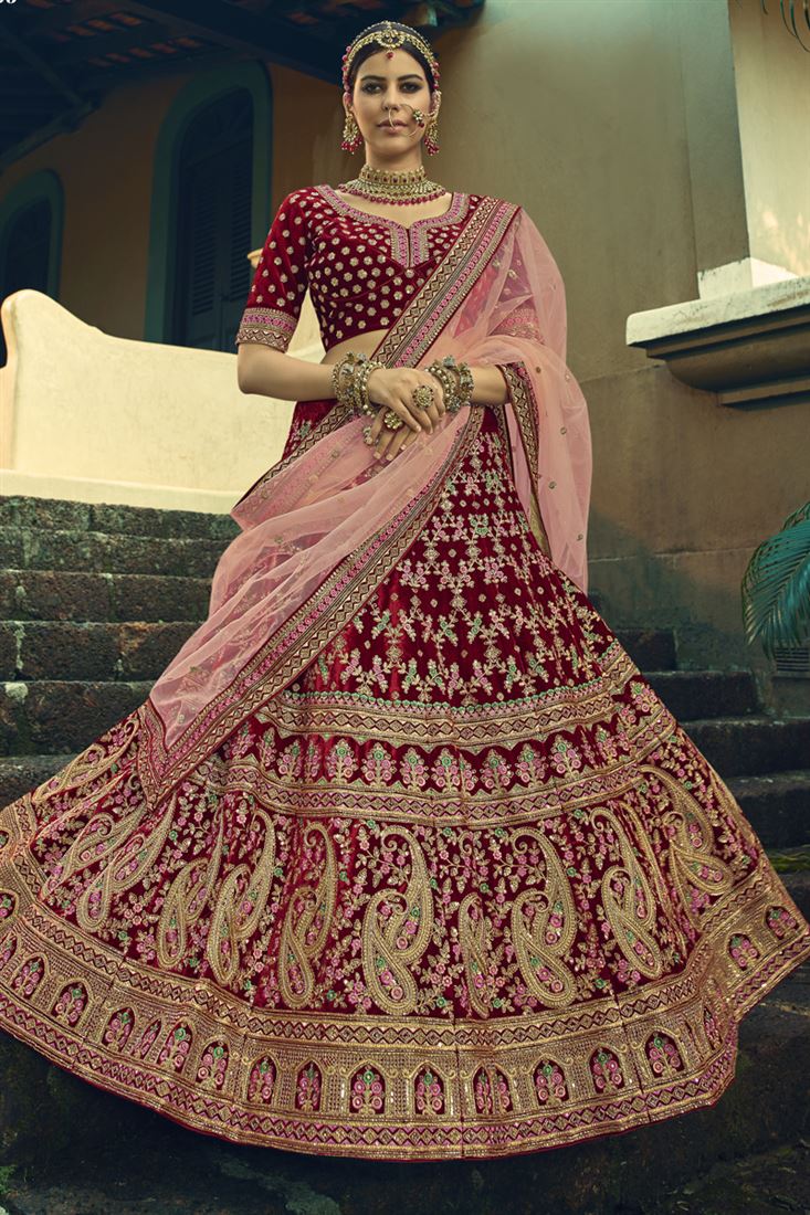 Exclusive Wedding Wear Velvet Fabric Designer Embroidered Lehenga Choli In Maroon Color