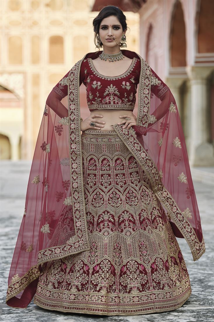 Exclusive Maroon Heavy Embroidered Wedding Wear Lehenga Choli In Velvet Fabric
