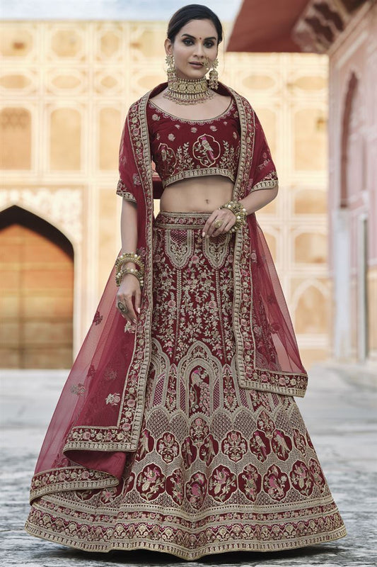 Exclusive Heavy Embroidered Wedding Wear Designer Lehenga Choli In Maroon Velvet Fabric
