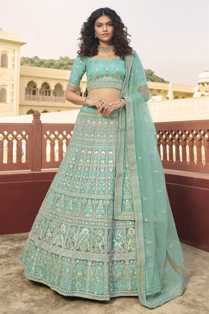 एक्सक्लूसिव ऑर्गेना फैब्रिक वेडिंग वियर सियान कलर कढ़ाई वाला लहंगा चोली