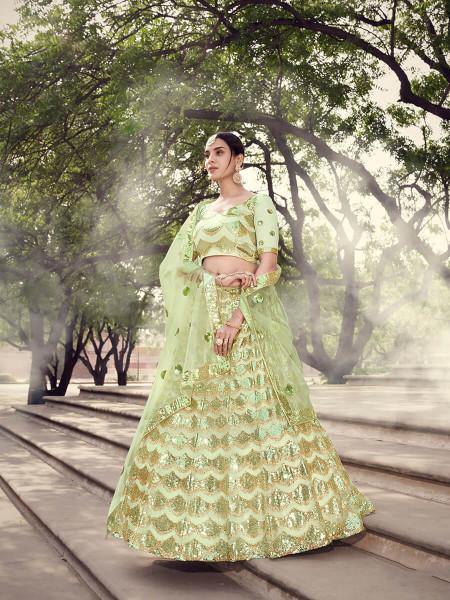 Pista Green Soft Net Heavy Embroidered Lehenga