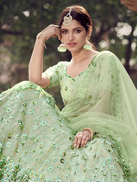 Pista Green Soft Net Heavy Embroidered Lehenga