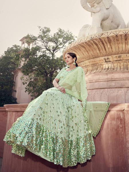 Pista Green Soft Net Heavy Embroidered Lehenga