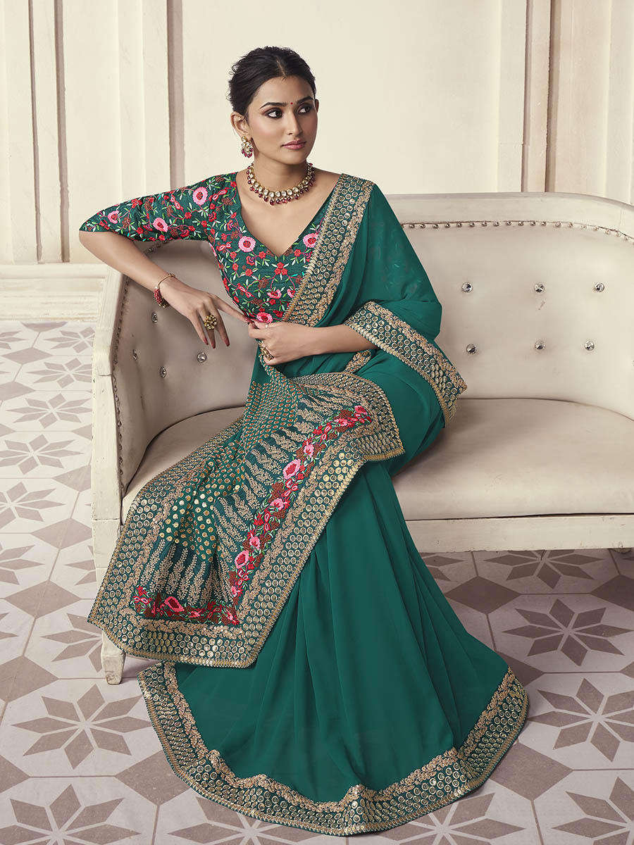 Green organza saree features art silk blouse