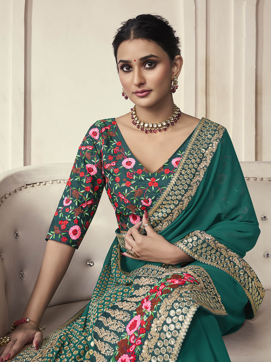 Green organza saree features art silk blouse