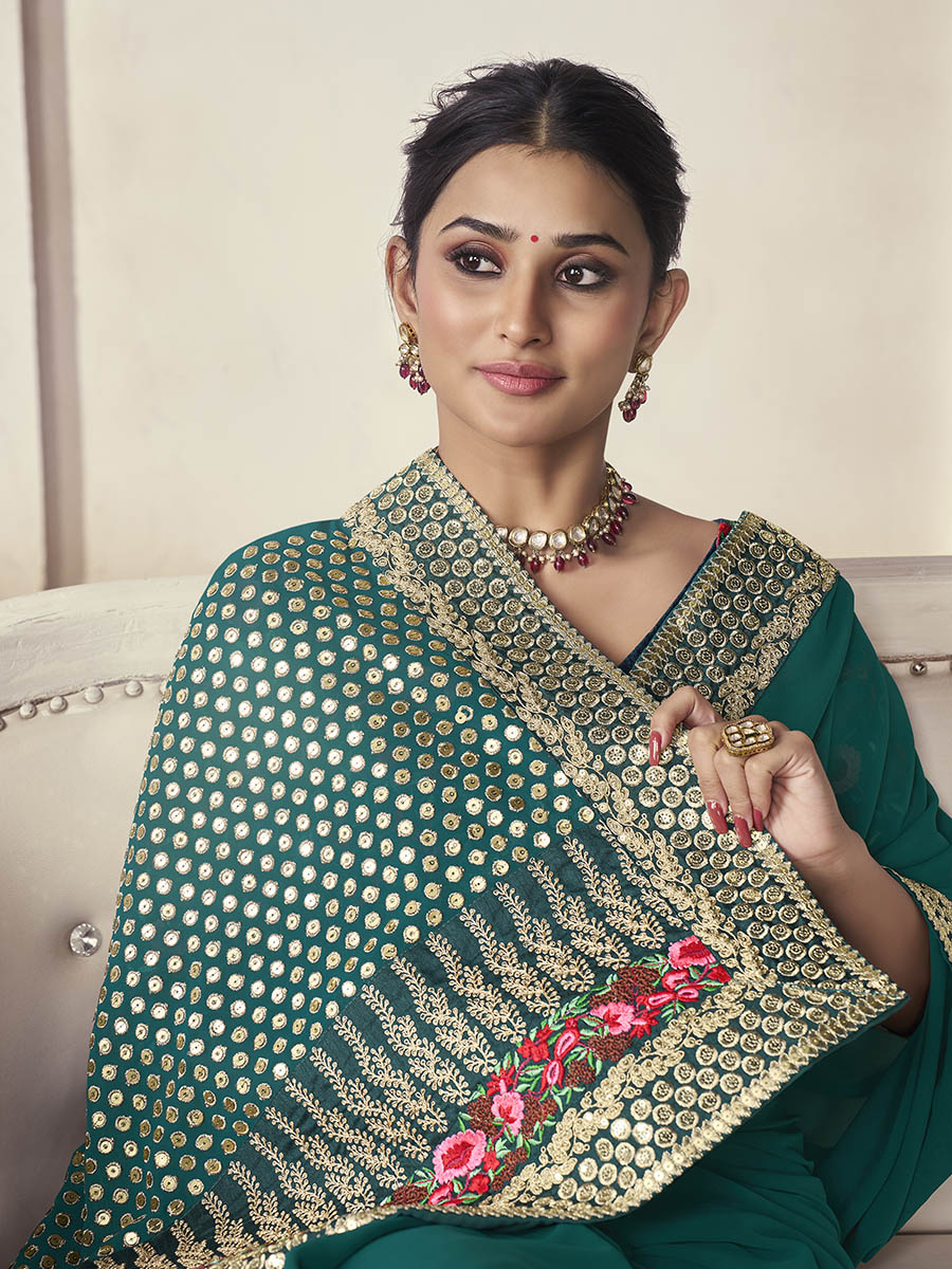 Green organza saree features art silk blouse