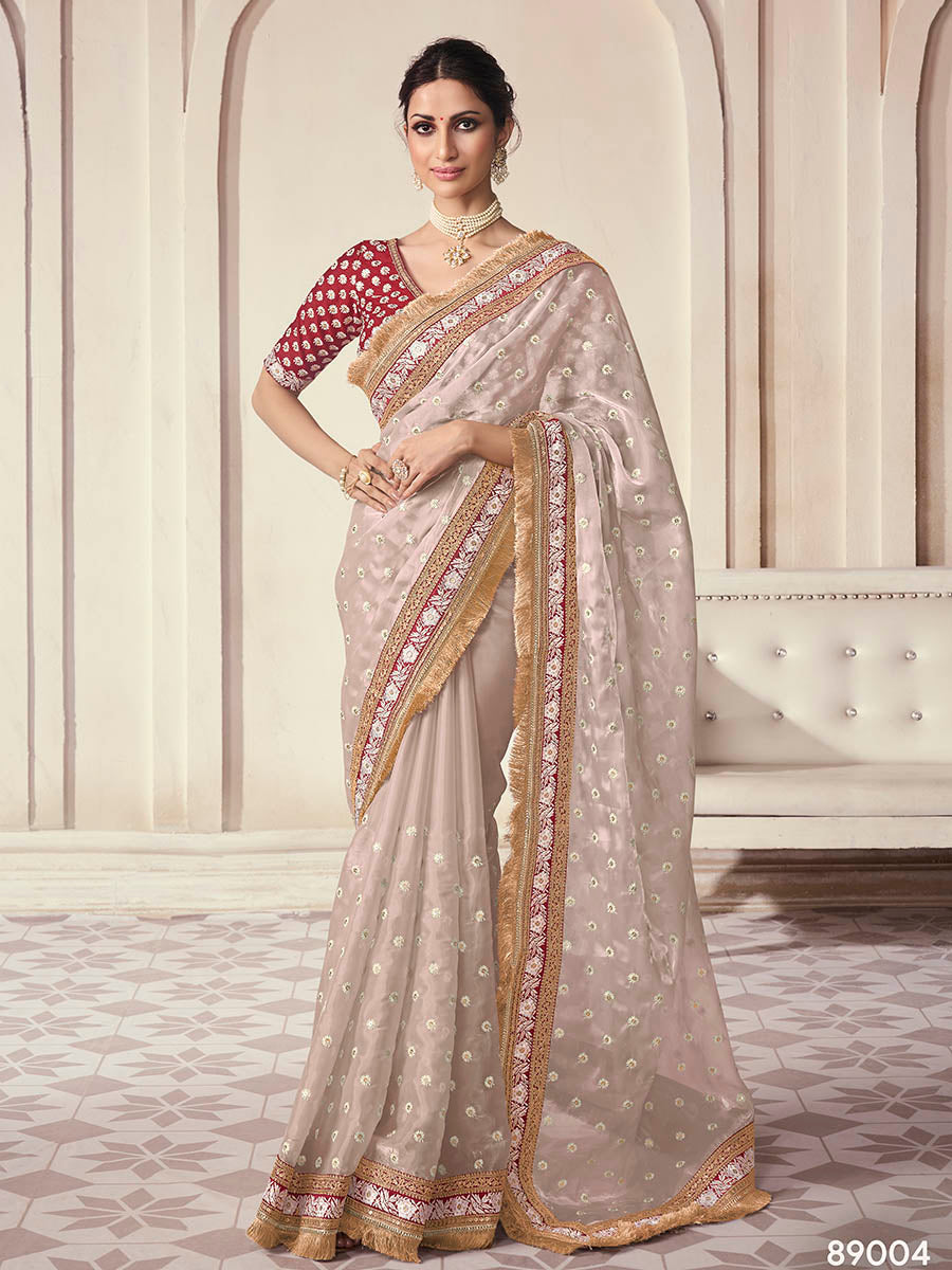 Beige organza saree features art silk blouse