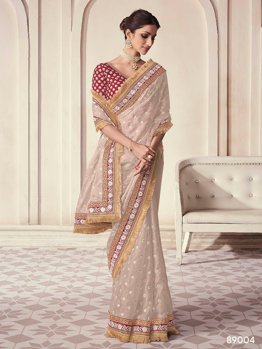 Beige organza saree features art silk blouse