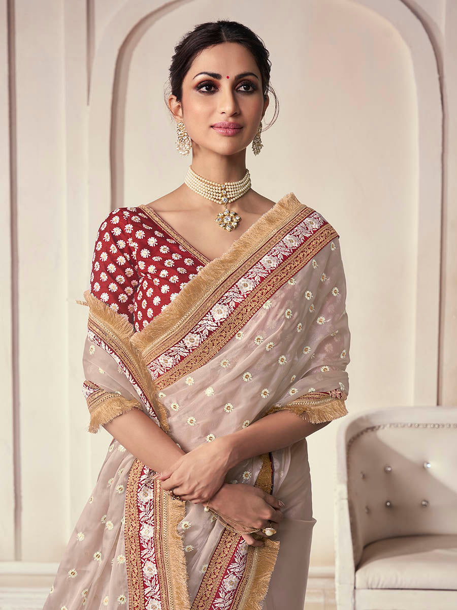 Beige organza saree features art silk blouse