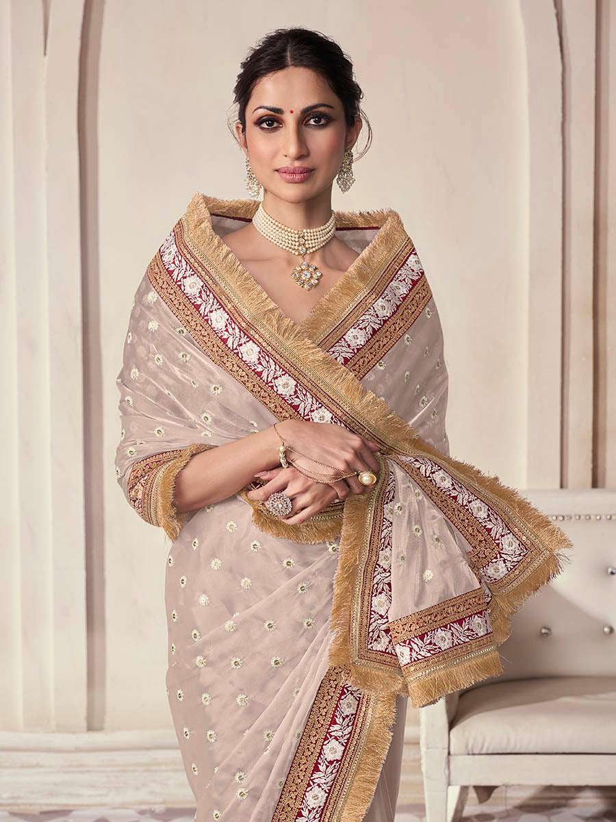 Beige organza saree features art silk blouse