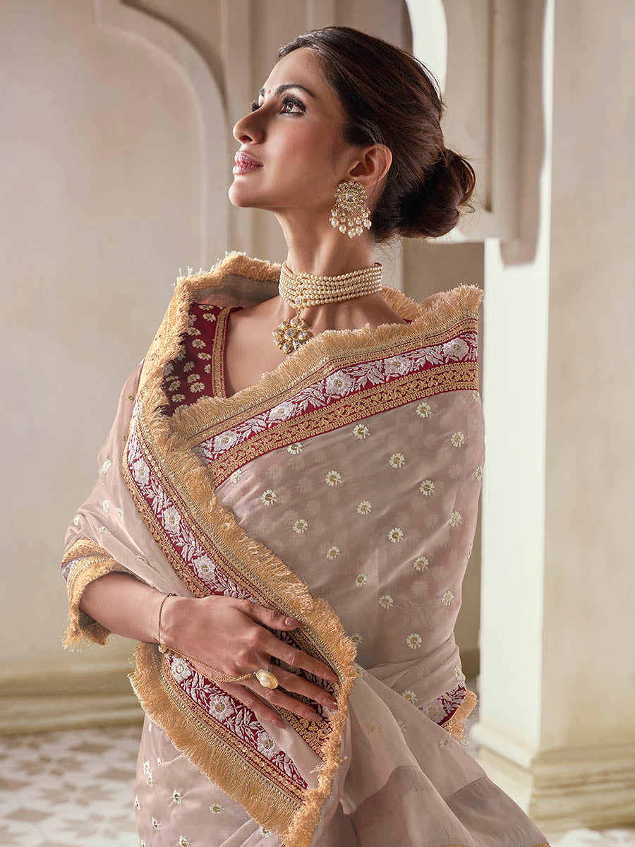 Beige organza saree features art silk blouse